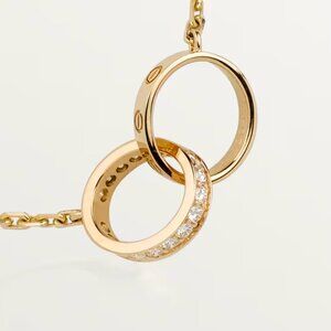 Cartier LOVE pendant, half-paved diamond necklace